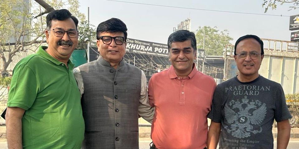 Team members smiling outdoors